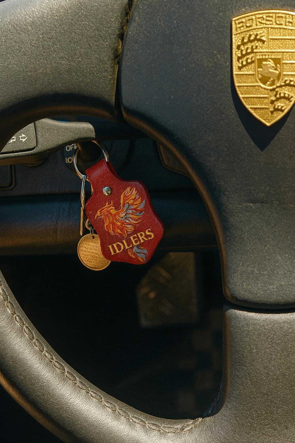 Custom leather keychain with dragon design for luxury Porsche interior